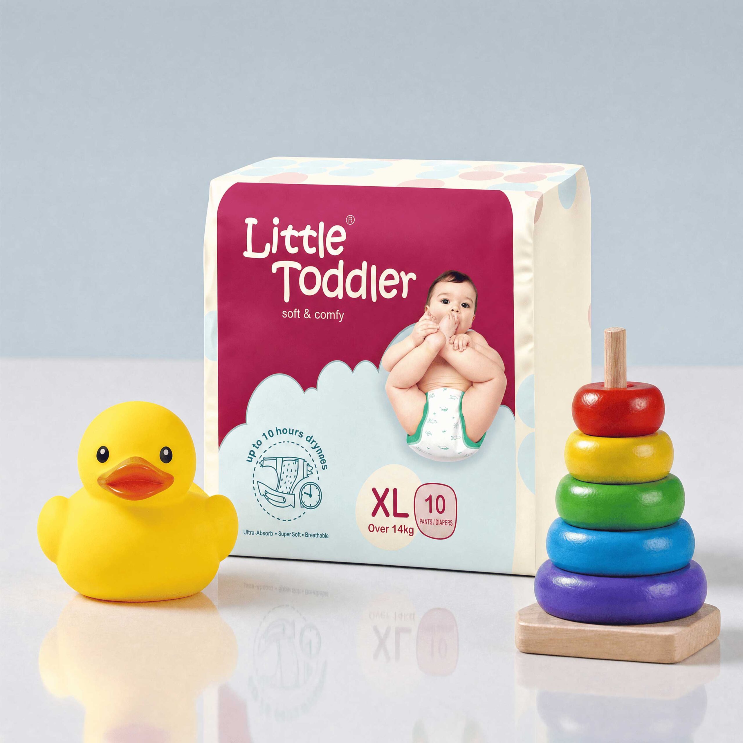 Green Napkins - Pouch Packaging: Little Toddler XL diaper pack beside a yellow rubber duck and a stacking ring toy