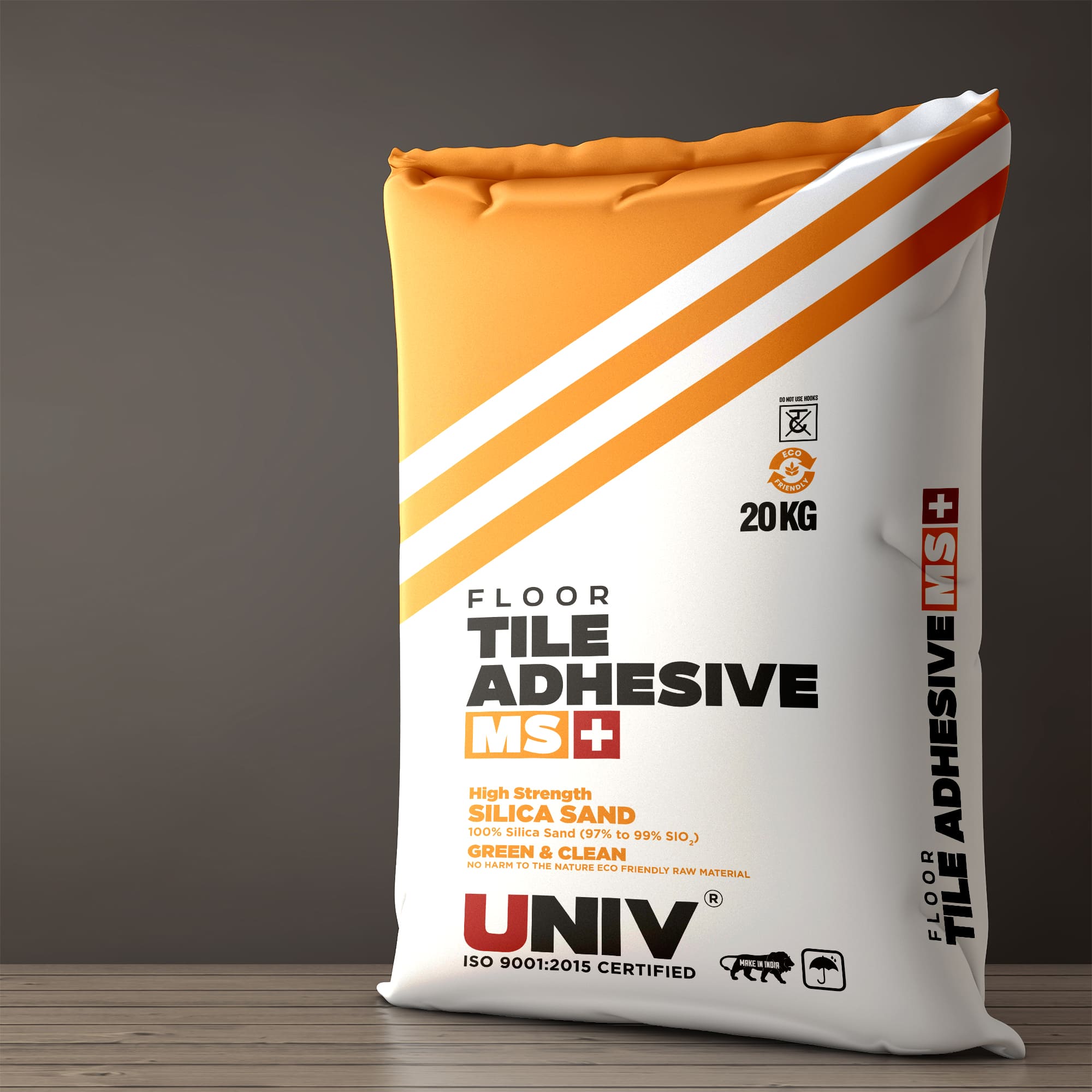 Univ - Bag Packaging: Univ Floor Tile Adhesive MS 20 kg bag in orange and white, on a wooden floor against a grey wall