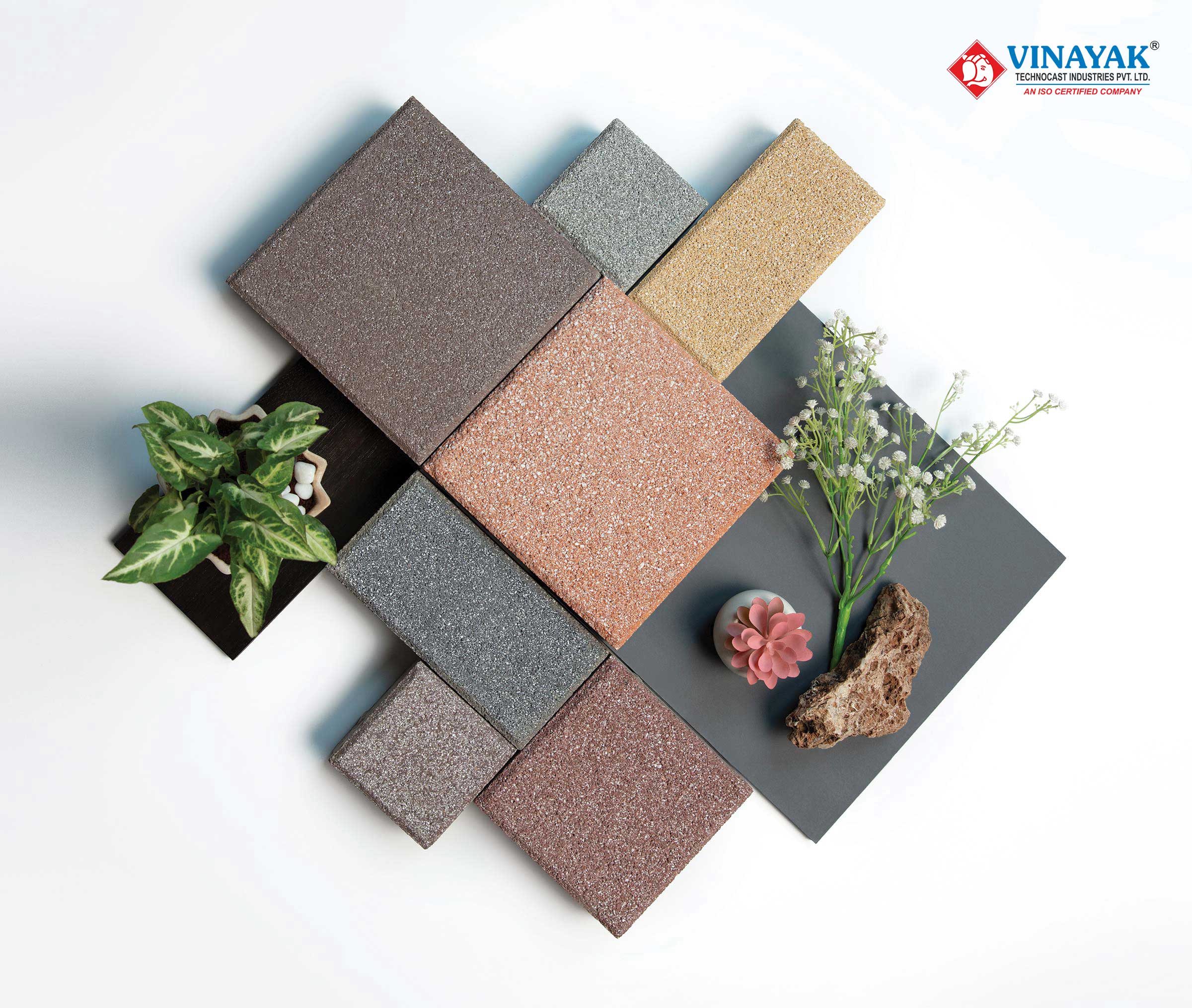 Vinayak Sanitarywares & Tiles: Tile samples in brown, pink, grey and sand arranged with green plants and flowers